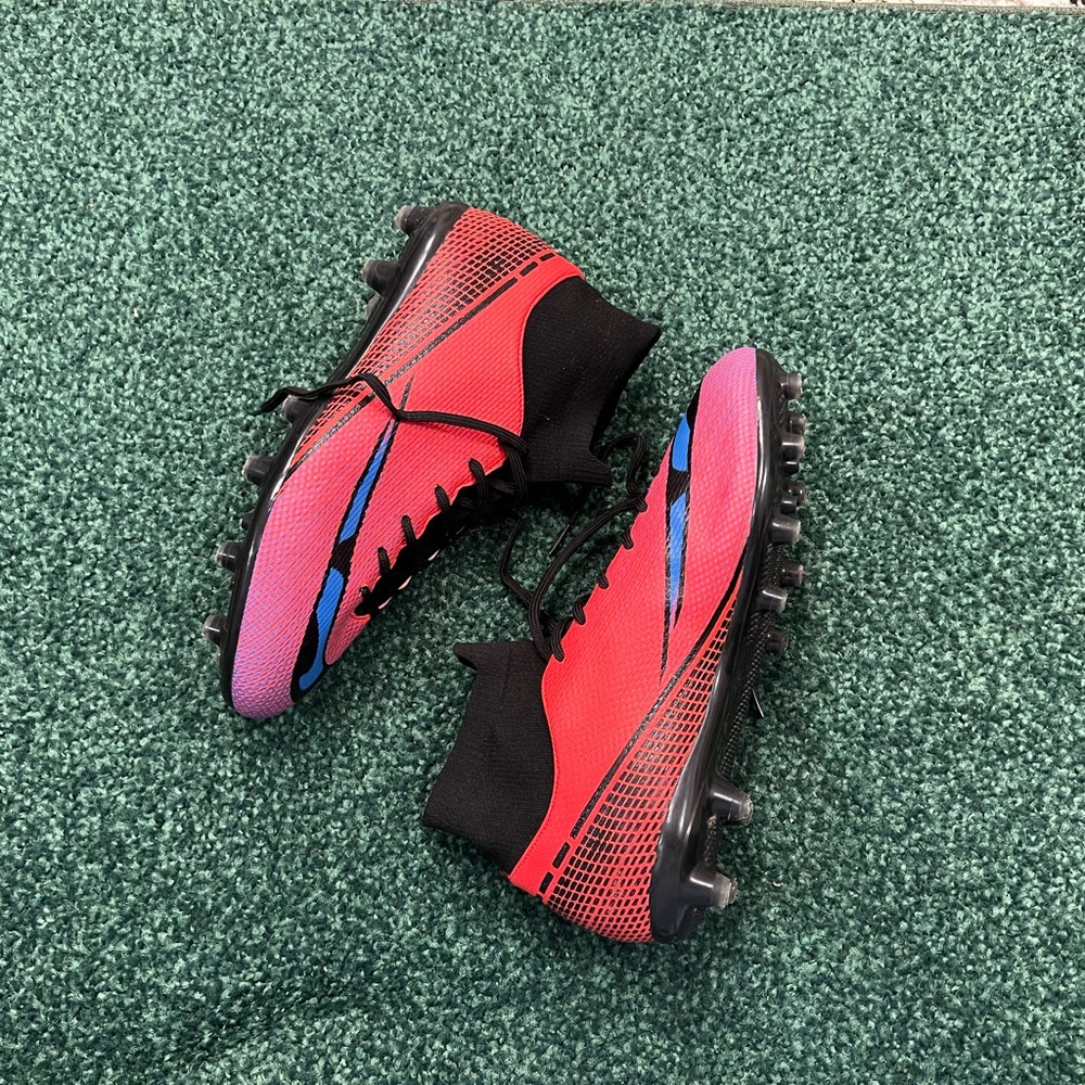 Vibrant Red and Black Soccer Cleats